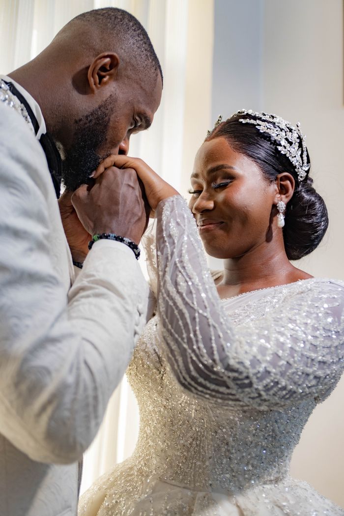 gallery-05 A joyful African couple shares a beautiful moment during their wedding ceremony.